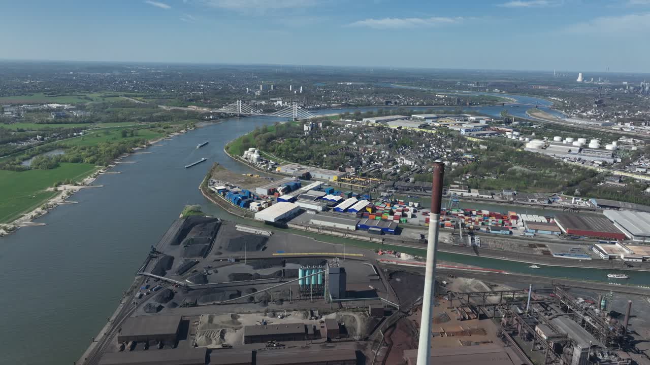 Rhine river, industrial ruhr region, shipping waterway for industrial transport. Infrastructure, Trade and industry in Germany. Aerial view.