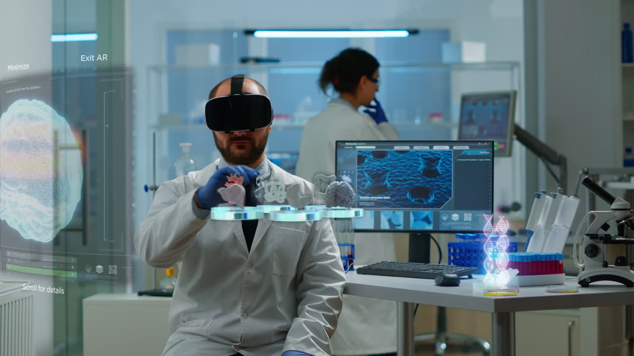 Male scientist in lab wearing VR goggles working on augmented reality virtual holograms