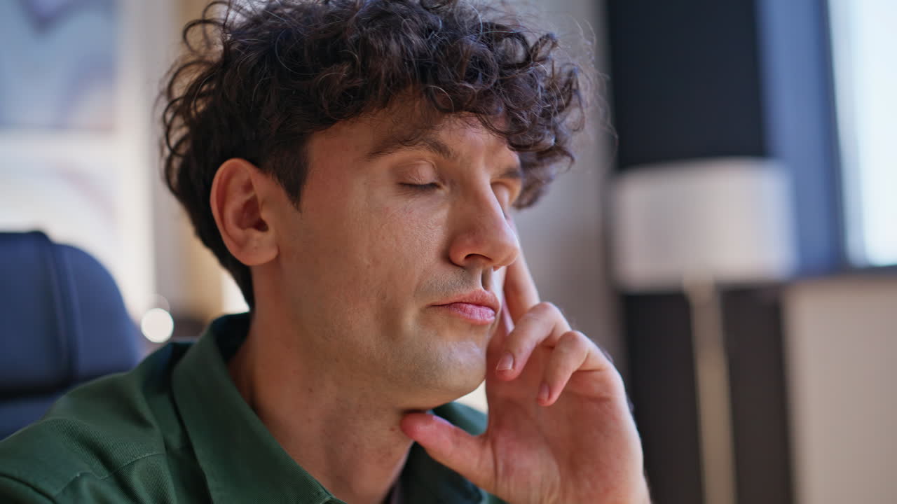 Closeup tensed employee thinking on work crisis at workplace. Serious freelancer