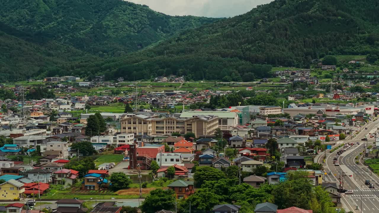 Aerial View of a Town Surrounded by Mountains