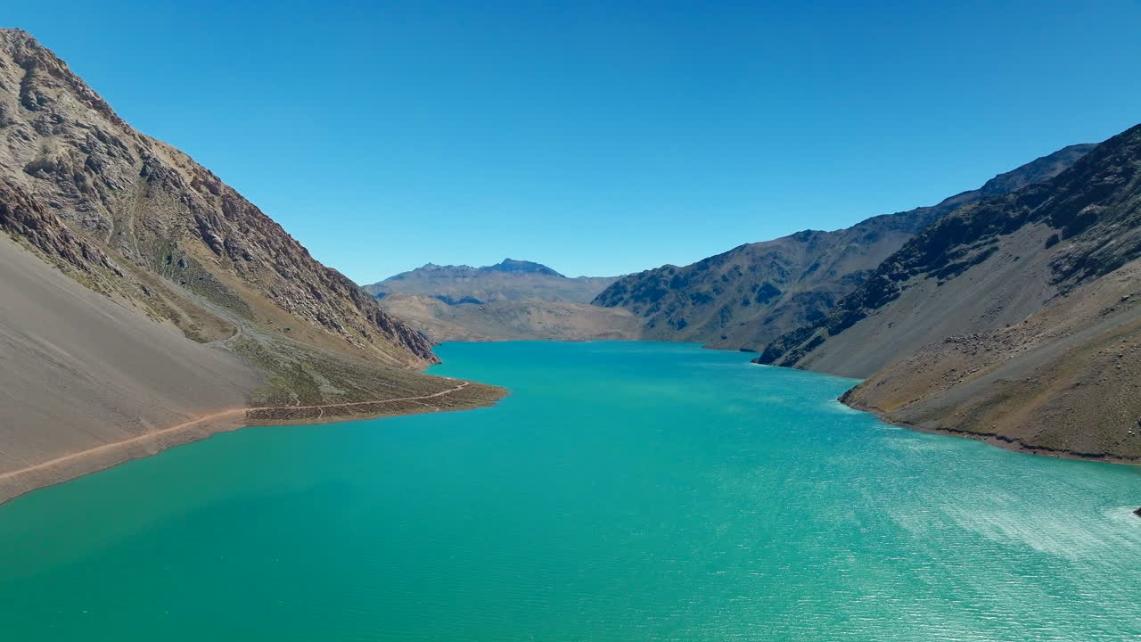 Drone over Embalse del yeso blue lake in Andes Mountains, Cajon del Maipo, Chile