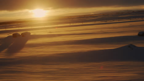 dramatic arctic sunset light over iceland's frosty tundra at sunrise amidst snowy landscapes