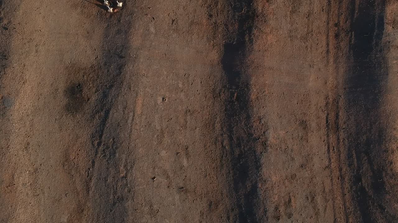 Drone ascending over an old drive in theatre