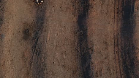 drone ascending over an old drive in theatre
