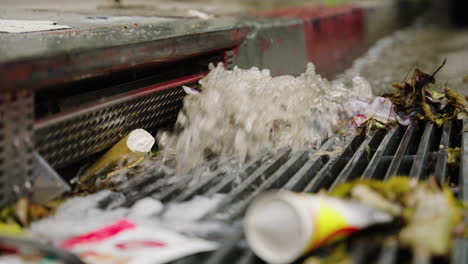 a storm drain on the street flooding in slow motion, waterfall