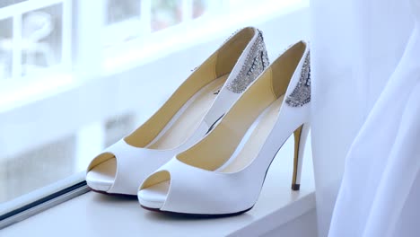 closeup-shot-of-the-bride-wedding-shoe