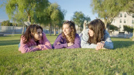 three girls relaxing in a park