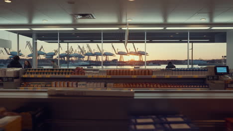 Modern Grocery Store with a Sunset Harbor View and Shipping Cranes