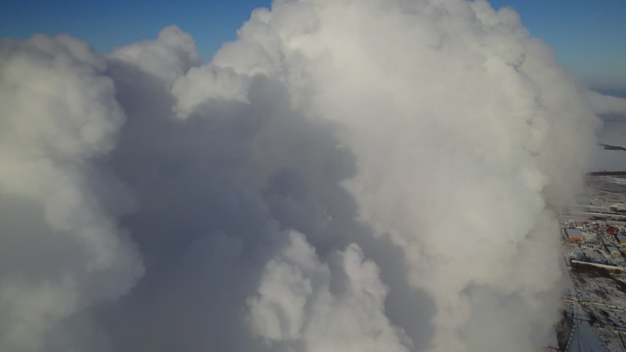 Massive Smoke Plume Over City in Winter
