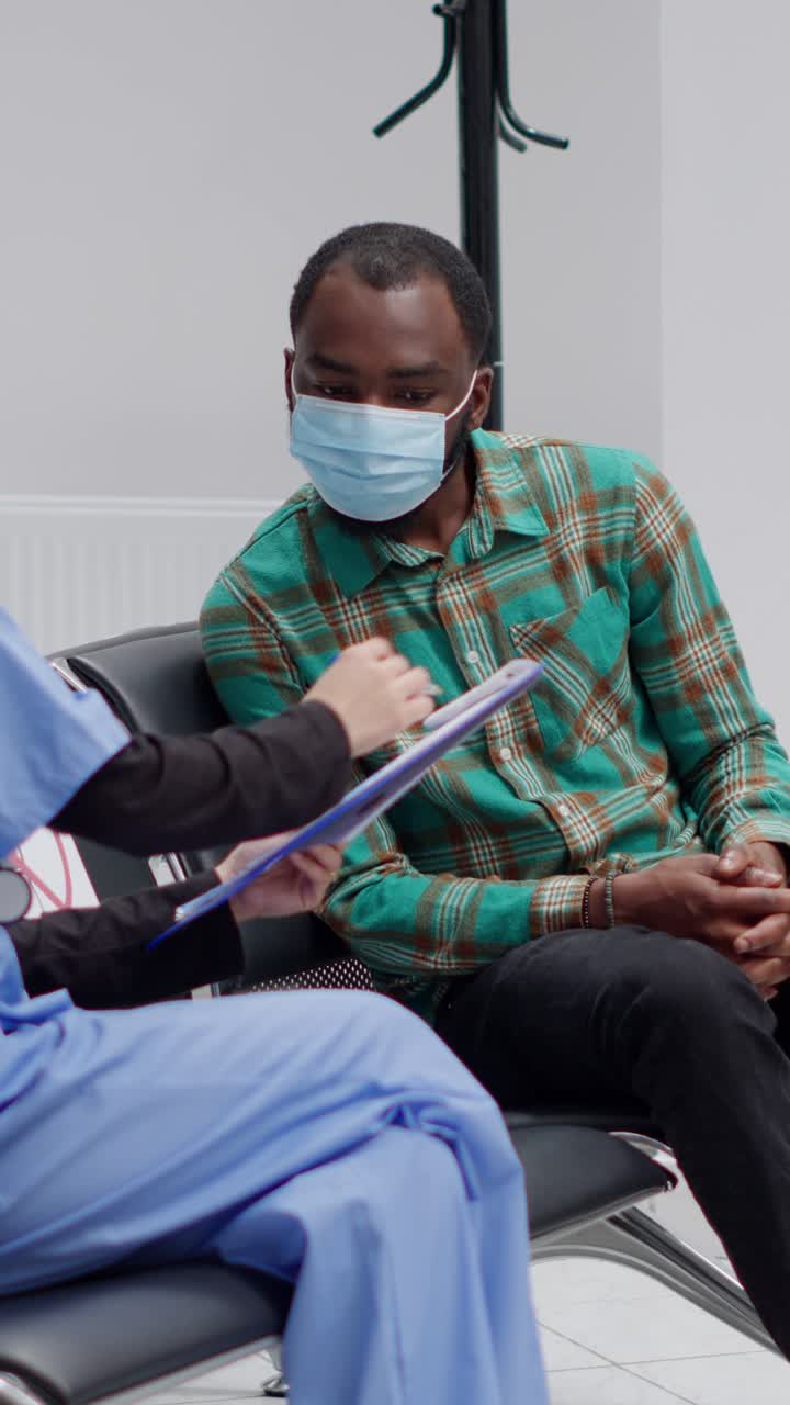 Healthcare professionals assisting patients in a waiting room
