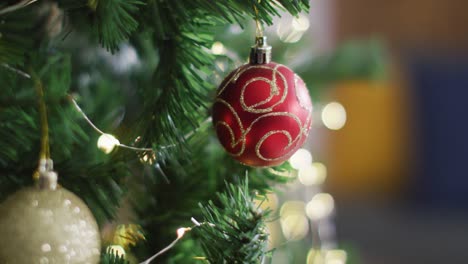 Video-of-christmas-tree-with-baubles-and-fairy-lights-decorations-on-blurred-background