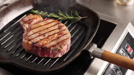 cooking a rib eye steak in a cast iron skillet