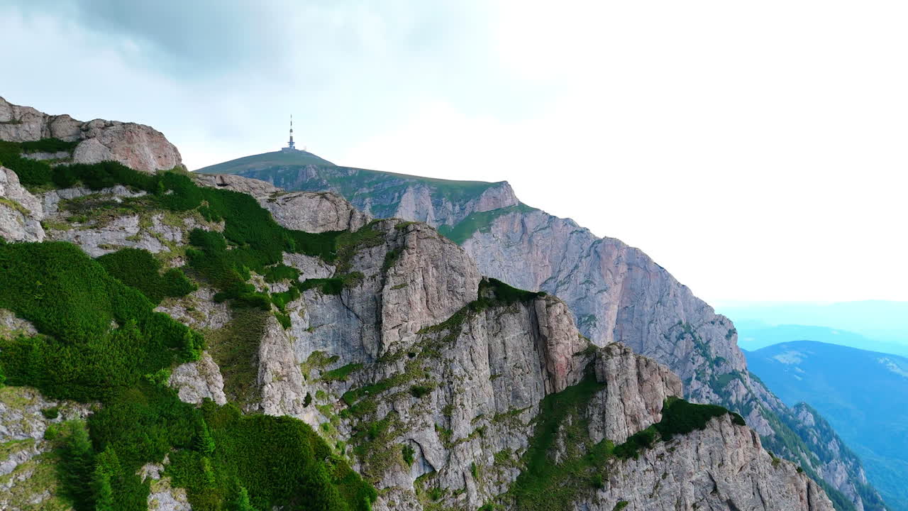 Stunning mountain view in Busteni Romania by cable car. Scenic view of rocky cliffs and lush greenery in Busteni, Romania, showcasing the beauty of the surrounding mountains