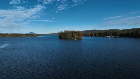 calm blue mountain lake in new york, united states - aerial drone shot