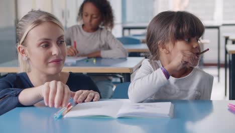 primary school teacher showing and explaining task