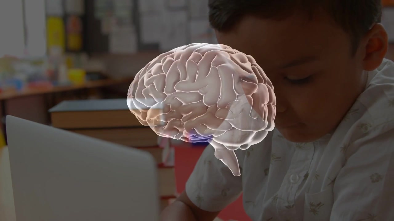 Brain hologram appearing over laptop boy leaning focusing while books revealing learning cues