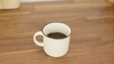 a cup of coffee with milk foam on top