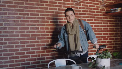 beautiful young woman getting ready leaving apartment with bicycle late for work