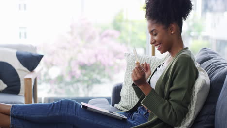 a young woman using a digital tablet with a credit