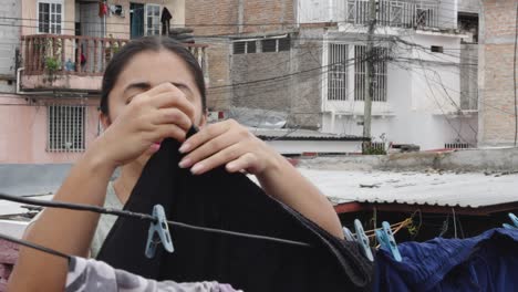 close-up of adult latin woman doing housework