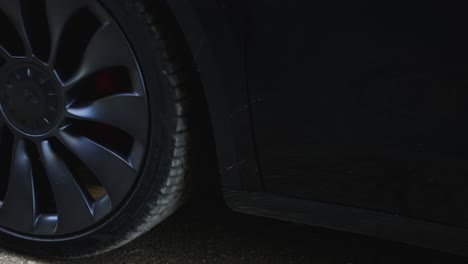 close-up of car wheels on dirt road