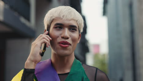 man talking on phone, pride parade