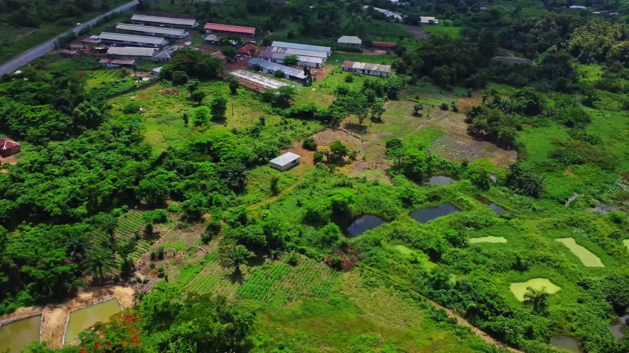 Aerial of farms and a small community in the beautiful countryside of Nigeria, Africa