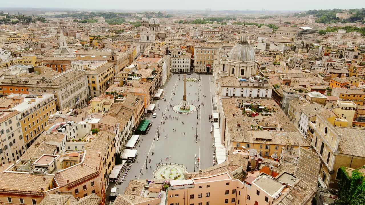 Wide drone of Rome’s Piazza Navona highlighting golden tones and peaceful mood