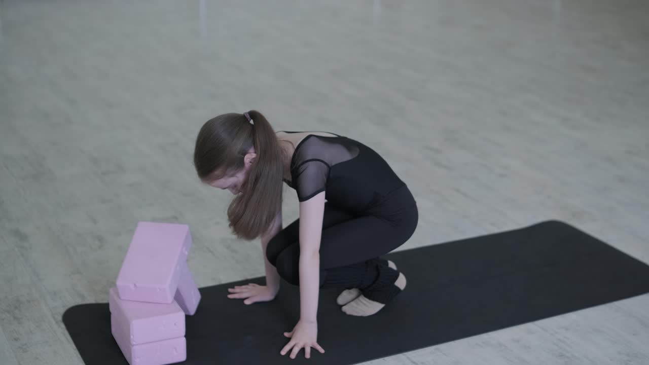 Young Ballerina Practicing Dance Moves in Studio