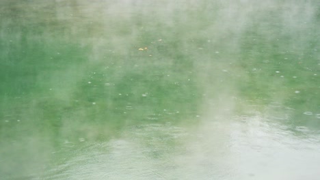 thermal valley hot spring lake smoky surface rain water ripple in beitou, taiwan taipei