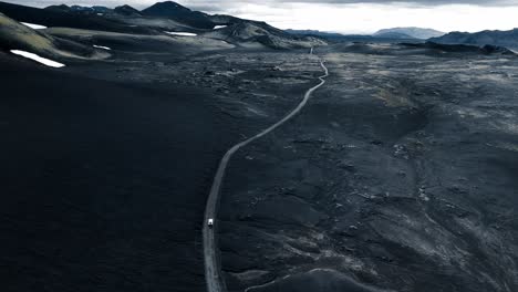 aerial drone footage, driving through the icelandic highlands