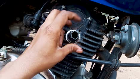 two-wheeler-motorbike-maintenance-at-day-from-flat-angle-in-details