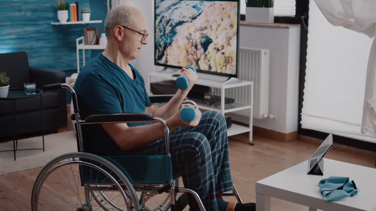 Man with disability using dumbbells to stretch arms muscles