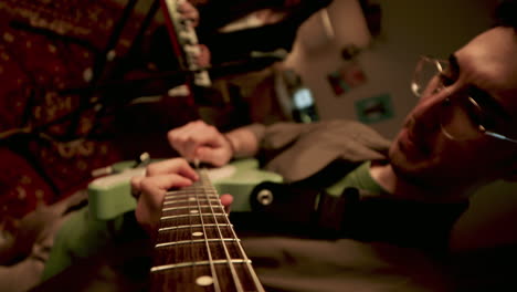 Man-playing-guitar