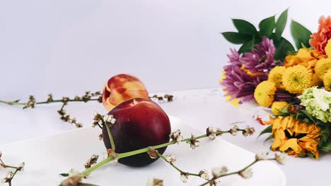 fresh peaches and a colorful bouquet