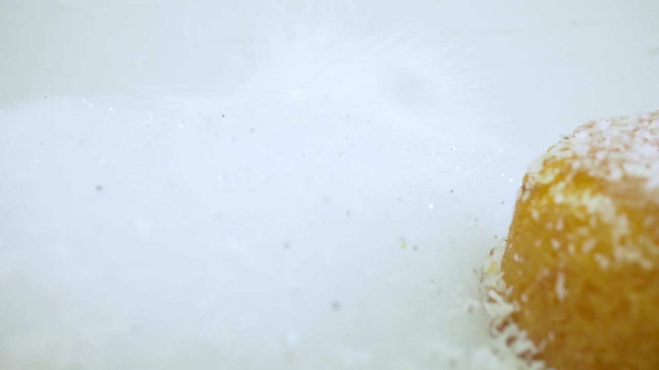 Delicious Donuts In Snow Sugar With Flaky Sprinkling Snow Effect. Snowy Desserts. close up, dolly-out shot