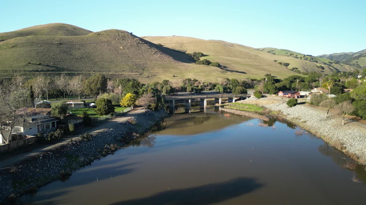 The Stanley Bridge extends into the distance, with rolling hills and urban developments framing the view.