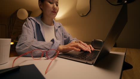 woman working late night at home