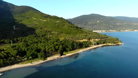 aerial flight through beautiful mountain over marmara sea and cars are driving on the ridgeway, balikesir, turkey