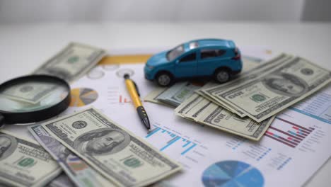 car insurance concept. car model drive on money with insurance paper background