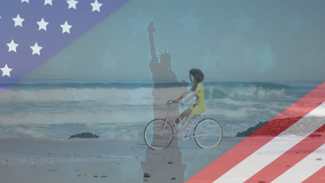 animation of american flag revealing statue of liberty and woman riding bike on beach