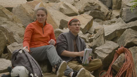 climbers sitting on a rock