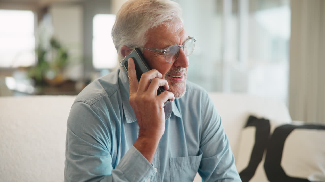 Senior man on phone at home