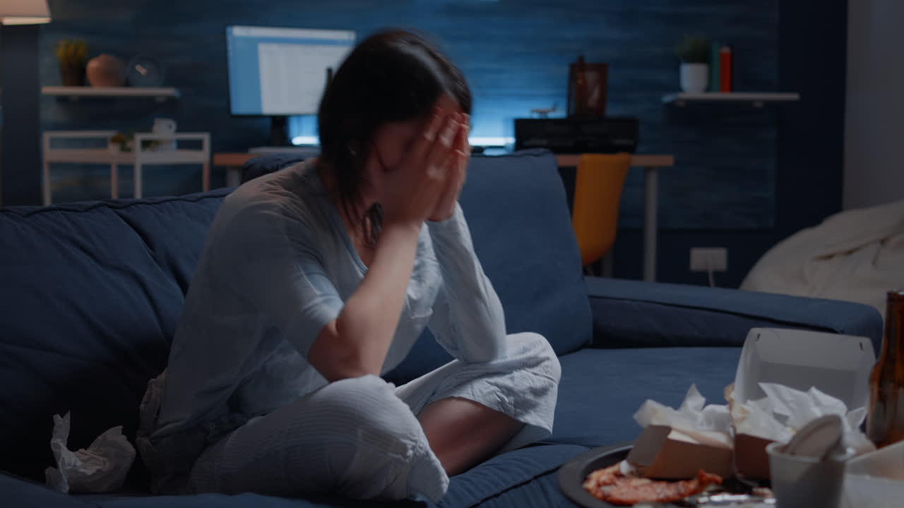 Frustrated woman breaking paper letter with banking termination notification