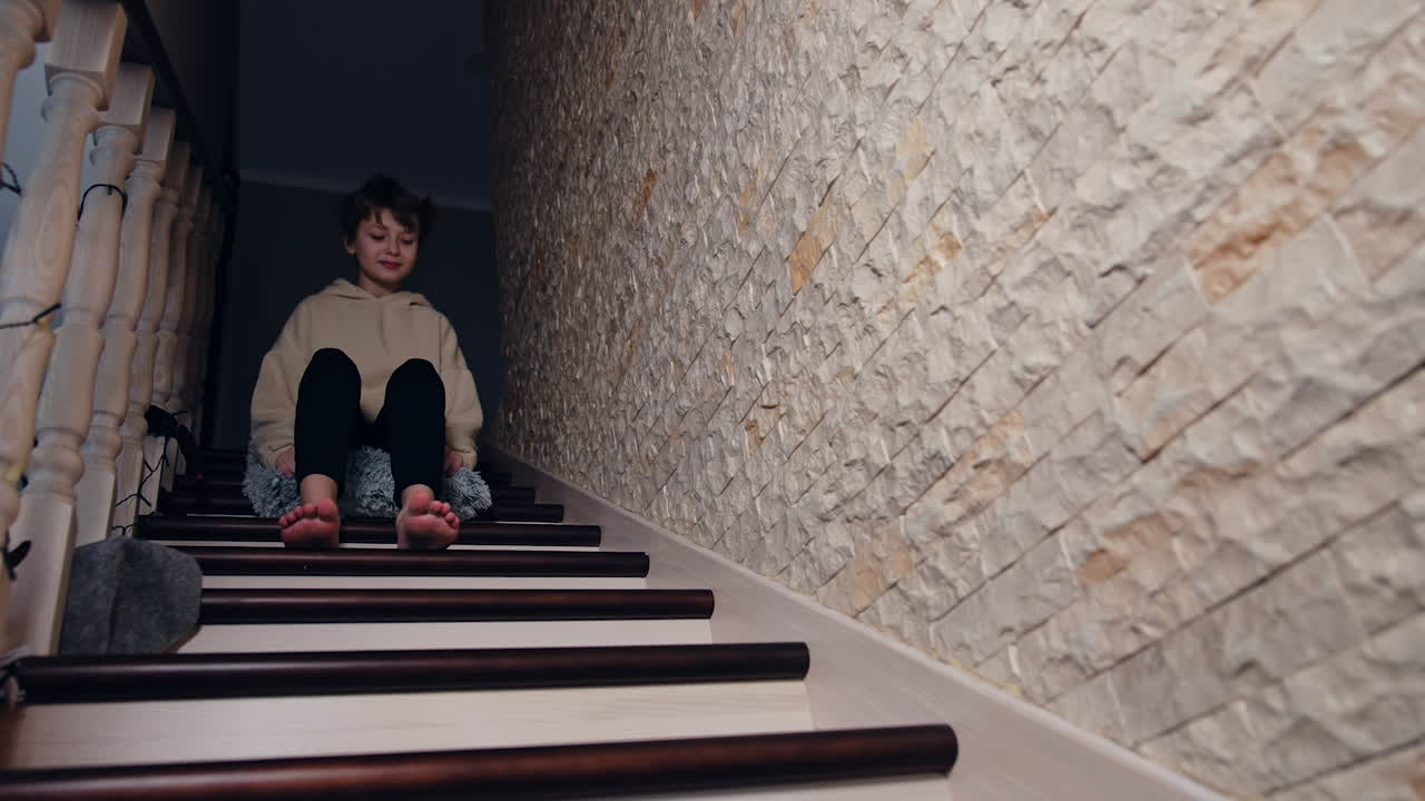 Boy sitting on stairs