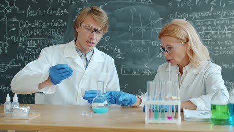 Scientists Conducting a Chemistry Experiment in a Lab