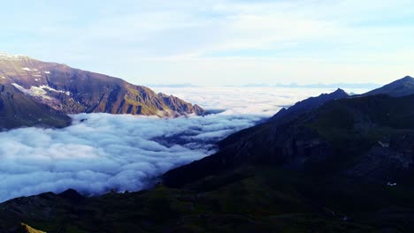 sunrise in alps, clouds filling valley, majesty of grosglockner high alpine road