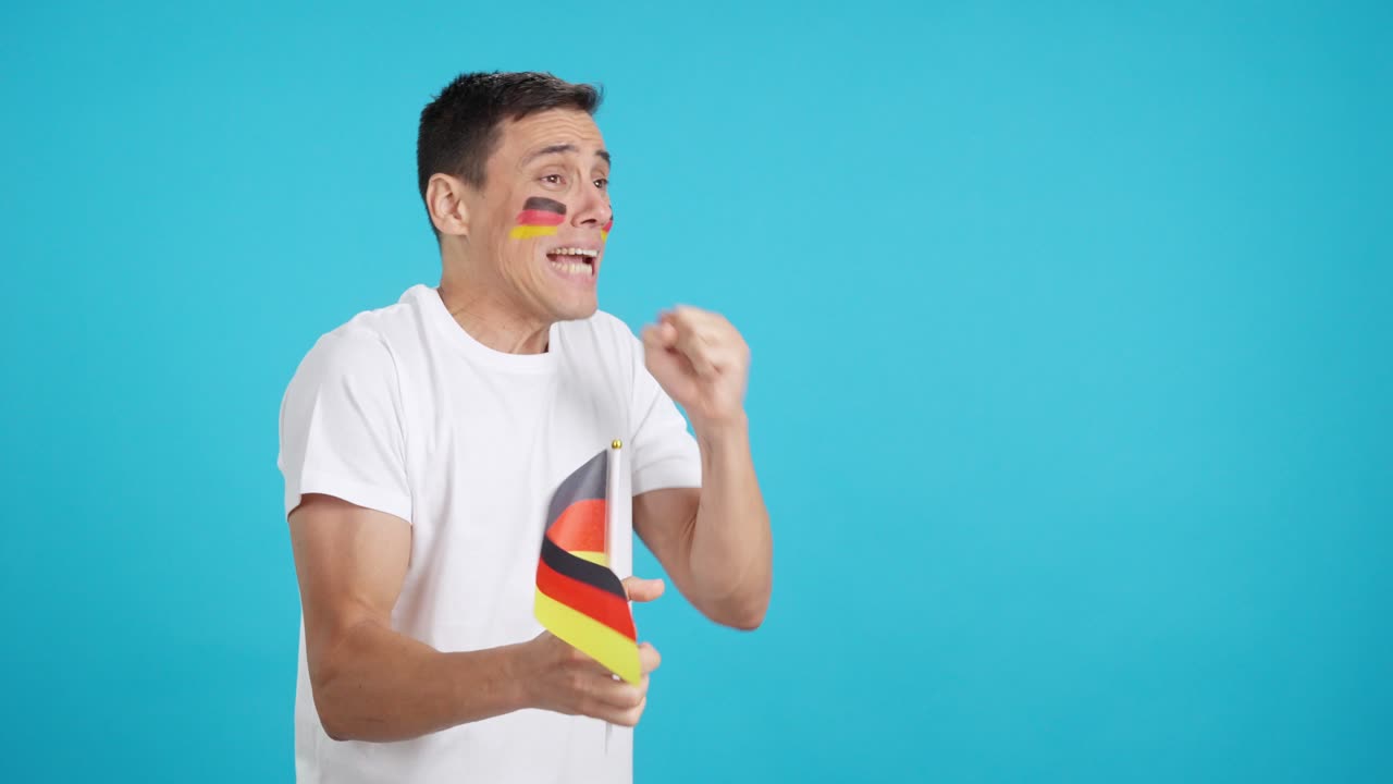 Nervous german supporter during an exciting match looking away