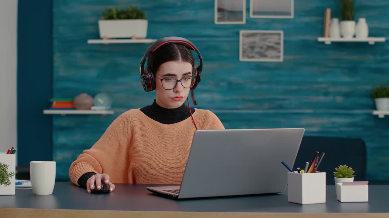 University student using headphones and laptop to attend online class