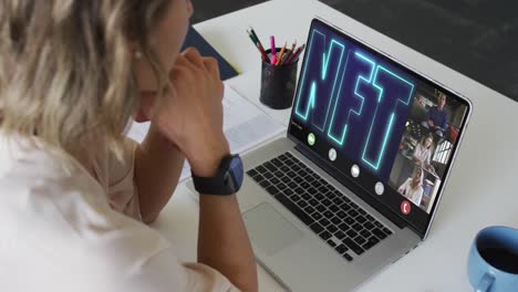 Caucasian-businesswoman-using-laptop-for-video-call-with-diverse-business-colleagues